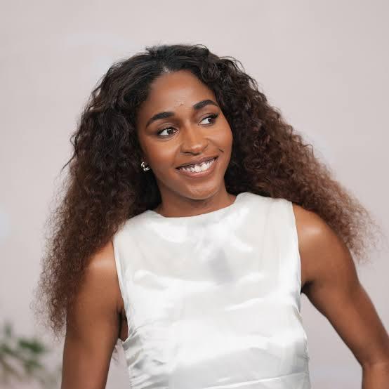 Ayo Edebiri brown curly hair